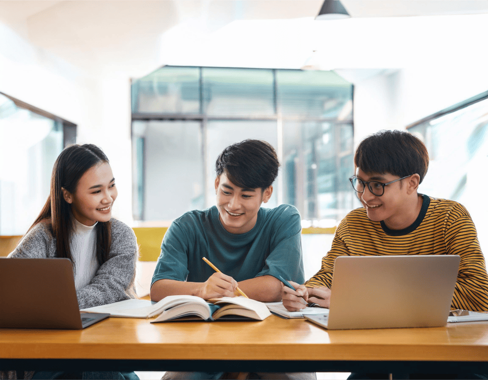 front-view-multiethnic-group-three-students-studying-together-around-table 1